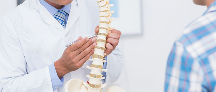 chiropractor discussing herniated disc